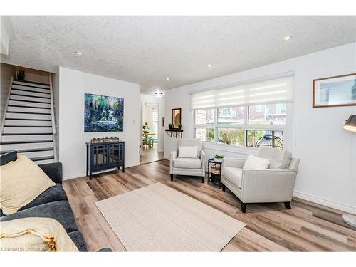 31-423 Westwood Drive, Kitchener, ON - Indoor Photo Showing Living Room With Fireplace