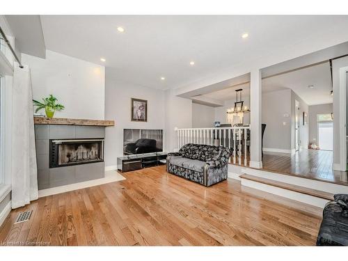 64-225 Benjamin Road, Waterloo, ON - Indoor Photo Showing Living Room With Fireplace