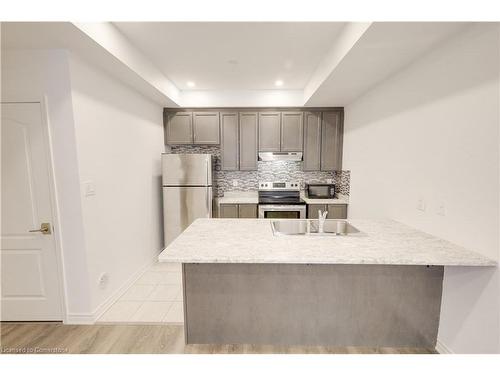 12-35 Heron Park Place, Toronto, ON - Indoor Photo Showing Kitchen With Stainless Steel Kitchen With Double Sink With Upgraded Kitchen