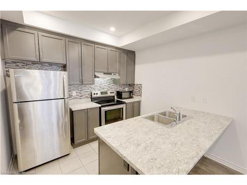 12-35 Heron Park Place, Toronto, ON - Indoor Photo Showing Kitchen With Stainless Steel Kitchen With Double Sink With Upgraded Kitchen