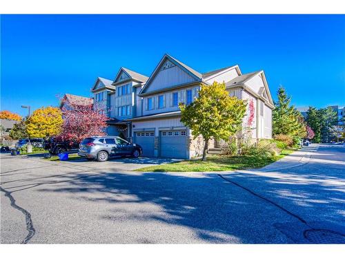 E29-85 Bankside Drive, Kitchener, ON - Outdoor With Facade