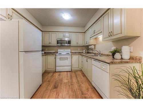 E29-85 Bankside Drive, Kitchener, ON - Indoor Photo Showing Kitchen With Double Sink