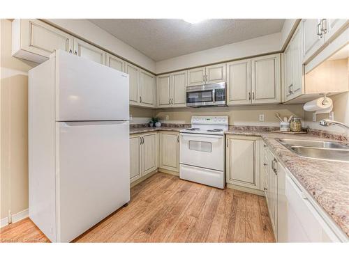 E29-85 Bankside Drive, Kitchener, ON - Indoor Photo Showing Kitchen With Double Sink