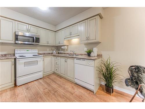 E29-85 Bankside Drive, Kitchener, ON - Indoor Photo Showing Kitchen With Double Sink