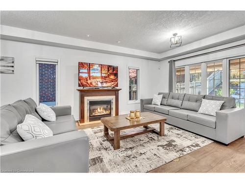 48 Isaiah Drive, Kitchener, ON - Indoor Photo Showing Living Room With Fireplace