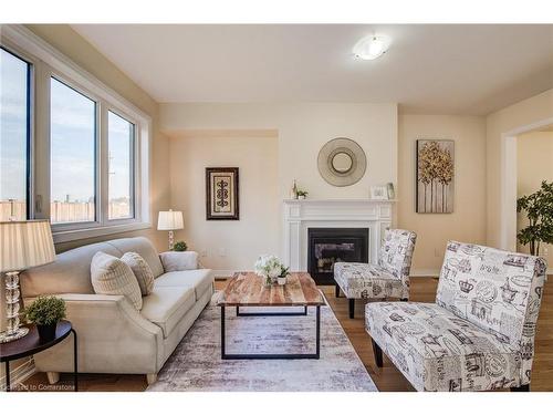 137 Huntingford Trail, Woodstock, ON - Indoor Photo Showing Living Room With Fireplace