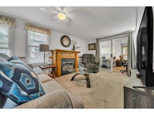 9-580 Beaver Creek Road, Waterloo, ON - Indoor Photo Showing Living Room With Fireplace