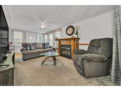 9-580 Beaver Creek Road, Waterloo, ON - Indoor Photo Showing Living Room With Fireplace