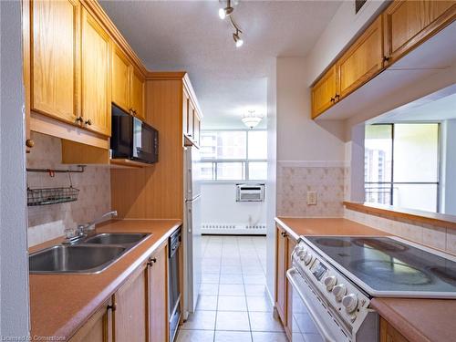 701-1950 Main Street W, Hamilton, ON - Indoor Photo Showing Kitchen With Double Sink