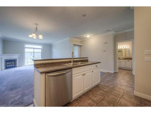 144-20 Isherwood Avenue, Cambridge, ON - Indoor Photo Showing Kitchen With Fireplace With Double Sink