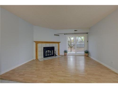 25-3085 Kingsway Drive, Kitchener, ON - Indoor Photo Showing Living Room With Fireplace