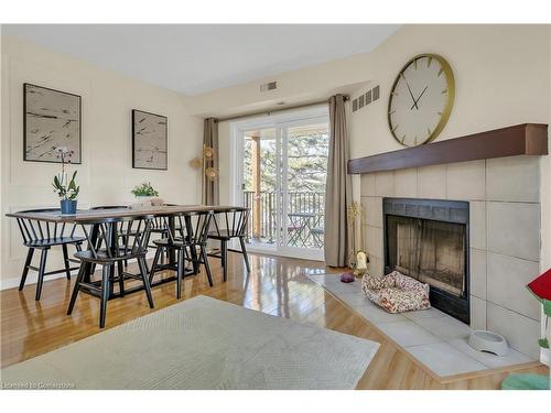 21-3085 Kingsway Drive, Kitchener, ON - Indoor Photo Showing Dining Room With Fireplace