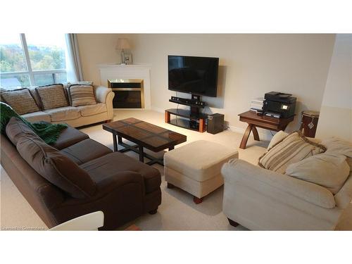 1106-255 Keats Way, Waterloo, ON - Indoor Photo Showing Living Room With Fireplace