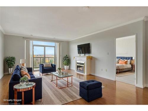 805-255 Keats Way, Waterloo, ON - Indoor Photo Showing Living Room With Fireplace