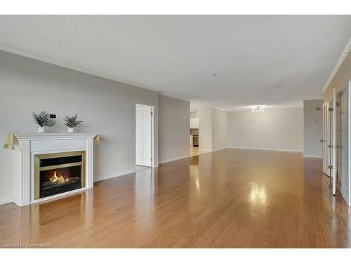 805-255 Keats Way, Waterloo, ON - Indoor Photo Showing Living Room With Fireplace