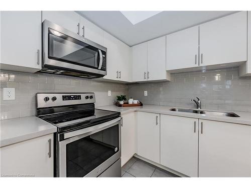 4-403 Westwood Drive, Kitchener, ON - Indoor Photo Showing Kitchen With Stainless Steel Kitchen With Double Sink