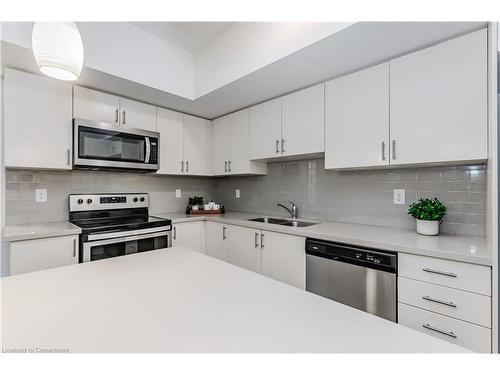 4-403 Westwood Drive, Kitchener, ON - Indoor Photo Showing Kitchen With Stainless Steel Kitchen With Double Sink