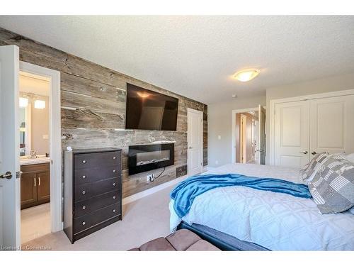 2-192 Brewery Street, Baden, ON - Indoor Photo Showing Bedroom With Fireplace