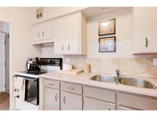 209-260 Sheldon Avenue N, Kitchener, ON - Indoor Photo Showing Kitchen With Double Sink