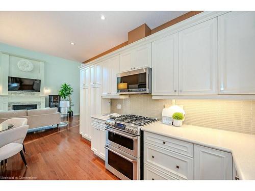 457 Golf Course Road, Conestogo, ON - Indoor Photo Showing Kitchen With Fireplace