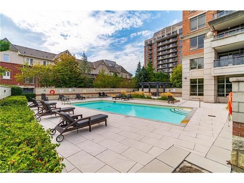 206-2379 Central Park Drive, Oakville, ON - Outdoor With In Ground Pool