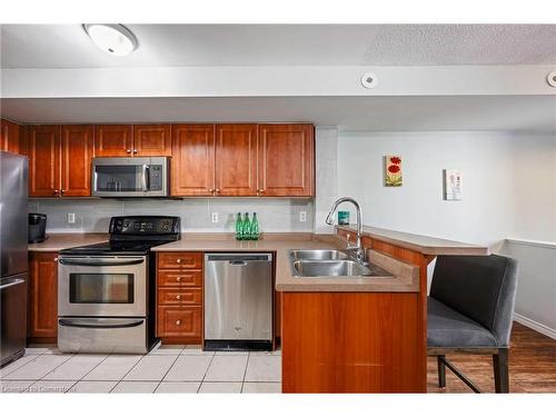 108-37 Four Winds Drive, Toronto, ON - Indoor Photo Showing Kitchen With Double Sink