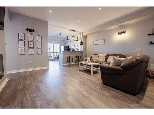 407-308 Watson Parkway N, Guelph, ON - Indoor Photo Showing Living Room With Fireplace