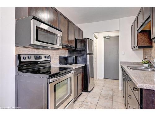 306-283 Fairway Road N, Kitchener, ON - Indoor Photo Showing Kitchen With Double Sink