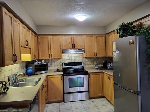 E34-85 Bankside Drive, Kitchener, ON - Indoor Photo Showing Kitchen With Double Sink