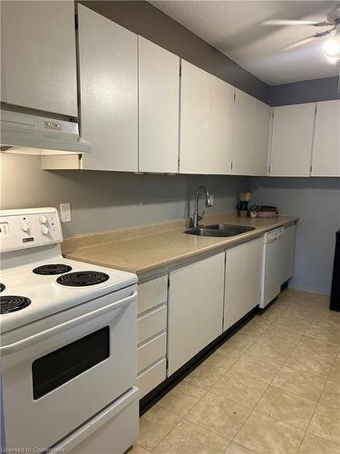 704-65 Westmount Road N, Waterloo, ON - Indoor Photo Showing Kitchen With Double Sink