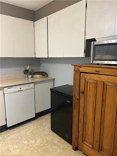 704-65 Westmount Road N, Waterloo, ON - Indoor Photo Showing Kitchen With Double Sink