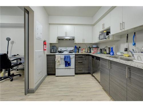 4-258A Sunview Street, Waterloo, ON - Indoor Photo Showing Kitchen With Double Sink