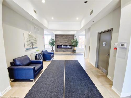 110-1360 Costigan Road, Milton, ON - Indoor Photo Showing Other Room With Fireplace