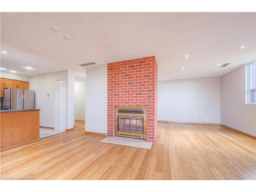 703-20 Ellen Street E, Kitchener, ON - Indoor With Fireplace