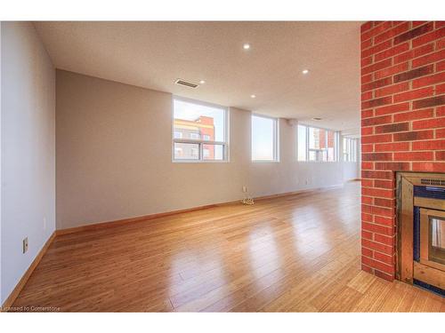 703-20 Ellen Street E, Kitchener, ON - Indoor Photo Showing Other Room With Fireplace