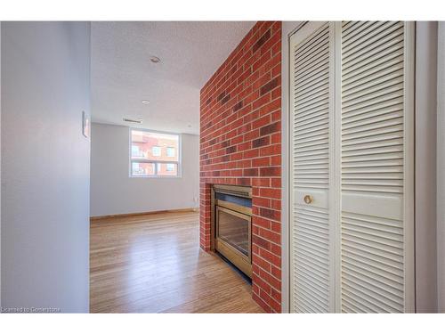 703-20 Ellen Street E, Kitchener, ON - Indoor With Fireplace