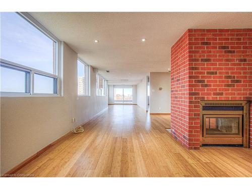 703-20 Ellen Street E, Kitchener, ON - Indoor Photo Showing Other Room With Fireplace