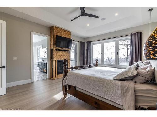 111 Grand Ridge Drive, Cambridge, ON - Indoor Photo Showing Bedroom With Fireplace