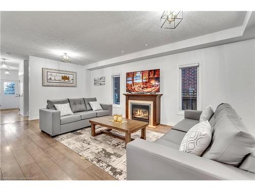 48 Isaiah Drive, Kitchener, ON - Indoor Photo Showing Living Room With Fireplace