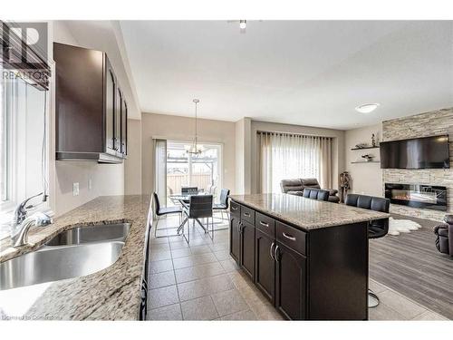 Upper-243 Greenwater Place, Kitchener, ON - Indoor Photo Showing Kitchen With Fireplace With Double Sink