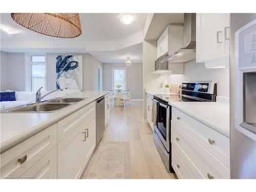 55-107 Westra  Dr, Guelph, ON - Indoor Photo Showing Kitchen With Double Sink