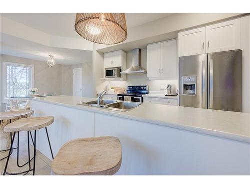 55-107 Westra  Dr, Guelph, ON - Indoor Photo Showing Kitchen With Double Sink