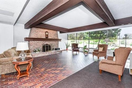 1607-225 Harvard Place, Kitchener, ON - Indoor Photo Showing Living Room With Fireplace