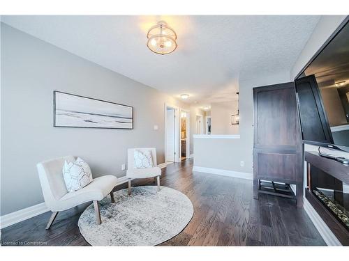 15-875 University Avenue E, Waterloo, ON - Indoor Photo Showing Living Room With Fireplace