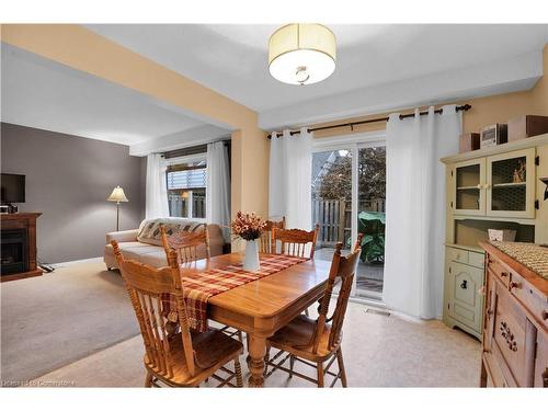 14-30 Bryan Court, Kitchener, ON - Indoor Photo Showing Dining Room With Fireplace