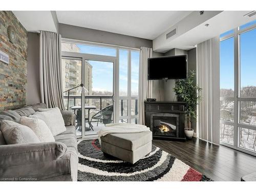 803-150 Water Street N, Cambridge, ON - Indoor Photo Showing Living Room With Fireplace