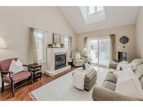 5A-350 Doon Valley Drive, Kitchener, ON - Indoor Photo Showing Living Room With Fireplace