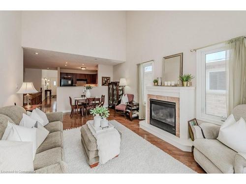 5A-350 Doon Valley Drive, Kitchener, ON - Indoor Photo Showing Living Room With Fireplace