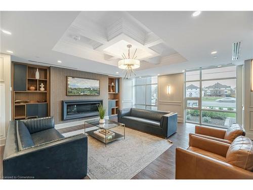 1105-460 Dundas Street E, Waterdown, ON - Indoor Photo Showing Living Room With Fireplace