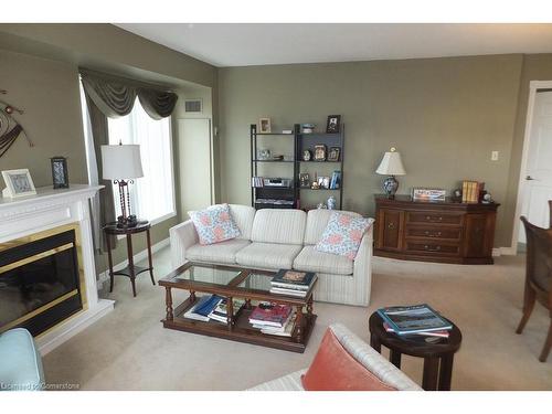 1004-237 King Street W, Cambridge, ON - Indoor Photo Showing Living Room With Fireplace